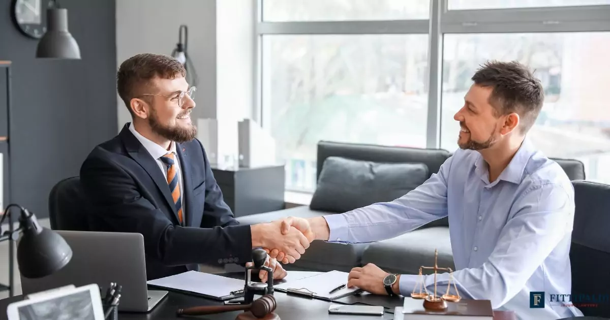 lawyer-client-meeting-melbourne-law-office Lawyer and client seated in a Melbourne law office, discussing legal strategy after a car accident case.